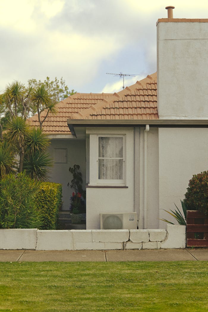 Suburban house facade in Geelong with lush garden and tiled roof, ideal for home design inspiration.